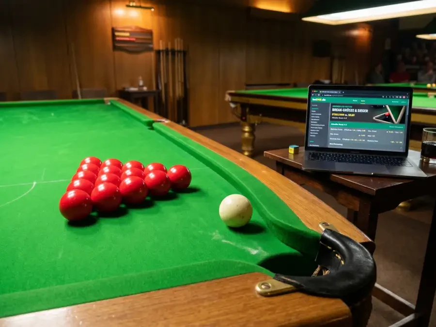 Snooker-Quoten auf einem Laptop-Bildschirm mit Taschenrechner und Notizblock daneben